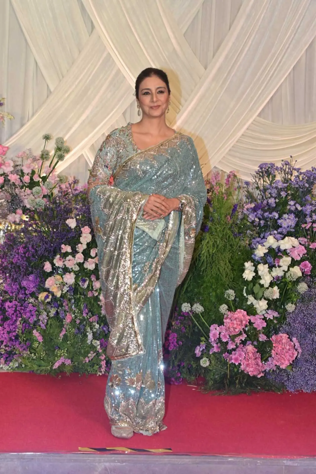 <p><span class="hover:entity-accent entity-underline inline cursor-pointer align-baseline"><span class="whitespace-normal">Tabu</span></span> made a graceful appearance in a grey shimmery saree featuring a golden-hued border. The elegant drape added a subtle sparkle to her look.</p>
